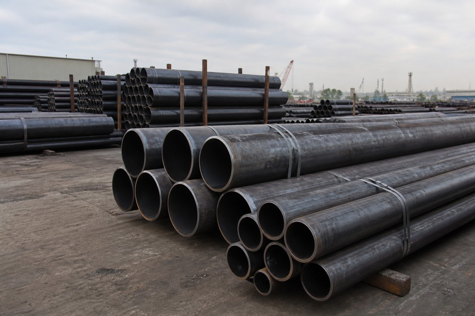 oil and gas pipeline steel pipe stockyard - API 5L line pipes stacked in a steel yard