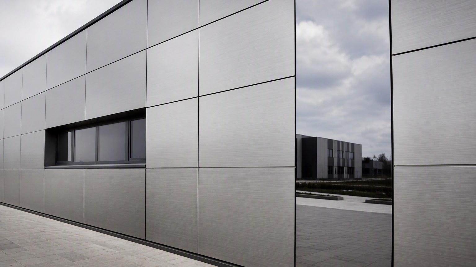 stainless steel surface finish - brushed No.4 and mirror finish stainless steel cladding on a building facade